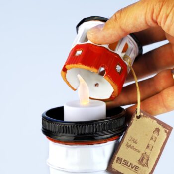 Nidos švyturio žvakidė su žvakute viduje